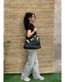 Vintage black leather bag with golden details 