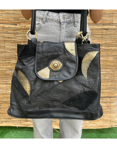 Vintage black leather bag with golden details 