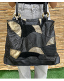 Vintage black leather bag with golden details 