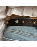 Vintage leather belt with metallic and shiny details 