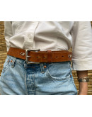 Vintage leather belt with metallic and shiny details 