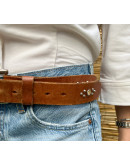 Vintage leather belt with metallic and shiny details 